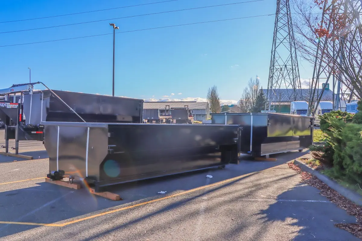 Roll-off dumpster ready for waste disposal at job site for 12 Yard Dumpster Rental in Auburn
